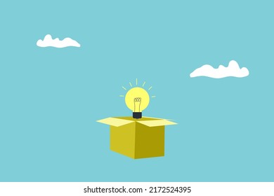 yellow light bulb coming out from a paper box
