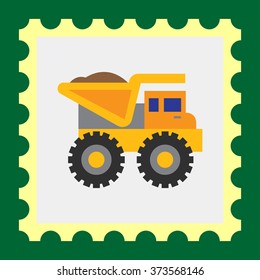 Yellow loaded dump truck