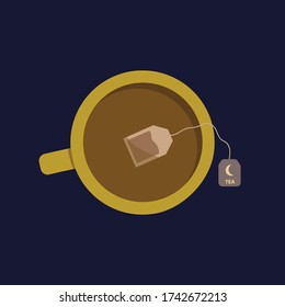 Yellow Mug With Night Time Tea Bag On Dark Blue Background