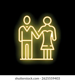 Yellow neon sign showing a couple holding hands, symbolizing love, relationship and togetherness