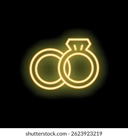 Yellow neon sign of two wedding rings with a big diamond glowing on a wall