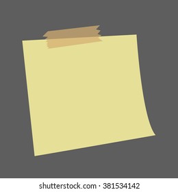 Yellow note paper isolated on dark background.