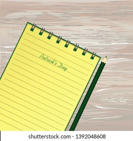 Yellow notebook with template hand-drawn Green festive bunting with clover and pencil. Irish holiday - Happy St. Patrick's Day with a garland of three-leaf. Greeting card. Vector on wooden back