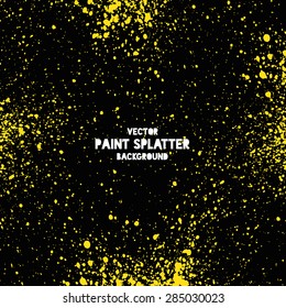 Yellow on black vector splatter background