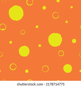 Yellow and orange geometric seamless pattern. Simple uneven round, circle, polka dot. Perfect for print, textile, fashion, scrapbooking, wallpaper, decor, cover, greeting card etc.