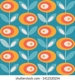 Yellow, orange and white abstract flowers and leaves with distressed texture on blue background