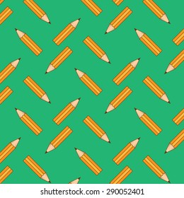 Yellow pencils on green background