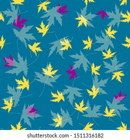

yellow purple and green maple leaves seamless pattern on blue background