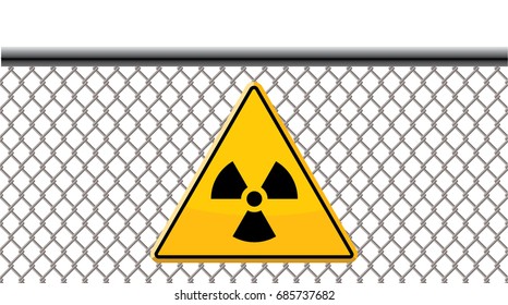 yellow radiation sign on wire fence
