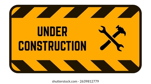 Yellow rectangular under construction sign featuring crossed hammer and wrench icons, indicating ongoing maintenance or building activities and promoting safety awareness