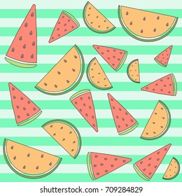 yellow and red watermelon slices on a green striped background