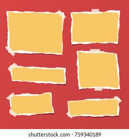 Yellow ripped strips, notebook, note paper for text or message stuck with sticky tape on bright red background.