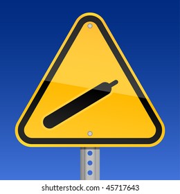 Yellow road hazard warning sign with gas symbol on a sky background