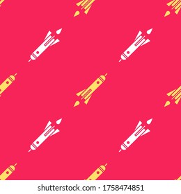 Yellow Rocket ship with fire icon isolated seamless pattern on red background. Space travel.  Vector Illustration