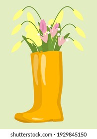 Yellow rubber boots with a bouquet of spring flowers