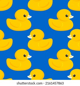 Yellow rubber duck. Seamless cute pattern with blue background for decorative textiles, modern fabrics. Vector.