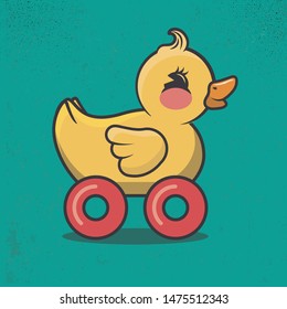 yellow rubber duckling with wheels
