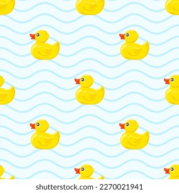 Yellow rubber ducks on blue background.  Seamless pattern. Texture for fabric, wrapping, wallpaper. Decorative print.Vector illustration