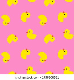 Yellow rubber ducks with orange beaks and black eyes on pink background, seamless pattern 