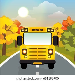 A yellow school bus with burning lights is on an asphalt road. Front view. Green meadow and trees. Back to school. Autumnal vector landscape can be used in newsletter, brochures, postcards, banner.