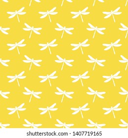 Yellow seamless pattern with white dragonflies. Cute and childish design for fabric, textile, wallpaper, bedding, swaddles toys or gender-neutral apparel.