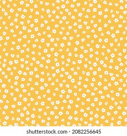 Yellow seamless pattern with white flowers