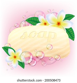 Yellow soap bar with bubbles and white flowers on pink background.