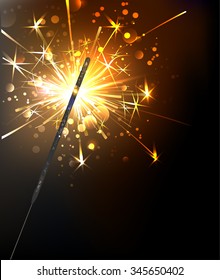 Yellow, sparkling sparkler on black background.