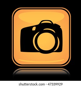 Yellow square icon photo camera with reflection over black background