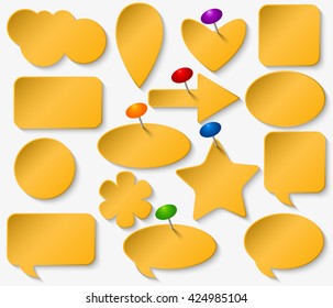 Yellow stickers set with colored pushpins.