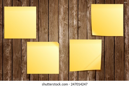Yellow sticky notes on wooden board