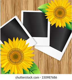 Yellow sunflowers and photo on wood background 