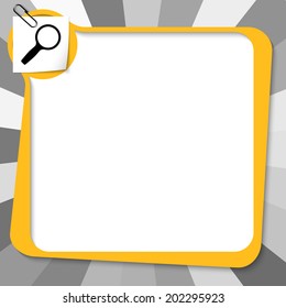 yellow text box with paper clip and magnifier