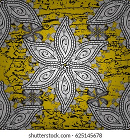 Yellow tree with gray trim. Small depth of field. Luxury furniture. Patina. Furniture in classic style. Element woodcarving. Pattern on yellow background with white elements. Carving.