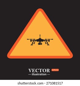 Yellow triangle on a black background. Quadrocopter. icon. vector design