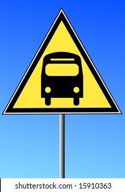 yellow triangle sign with a bus against a blue sky  - transportation concept