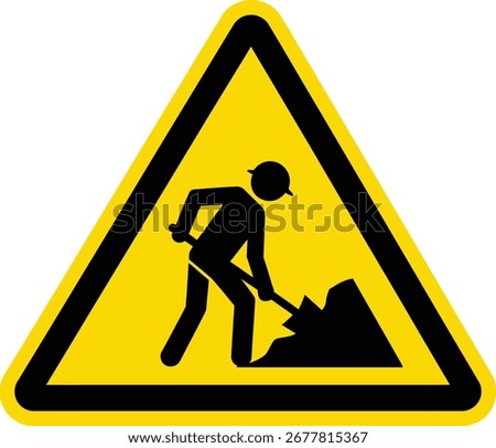 A yellow triangle warning sign with a black border depicts a person using a shovel, indicating ongoing road construction or maintenance work.