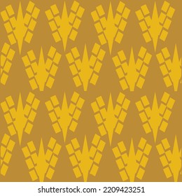 Yellow triangular brooch with stars decorated.