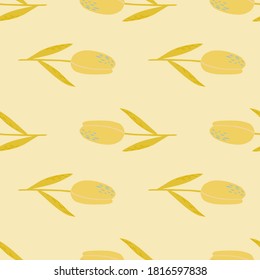 Yellow tulip silhouettes seamless doodle pattern. Hand drawn flowers ornament on light pastel background. Perfect for wallpaper, textile, wrapping paper, fabric print. Vector illustration.