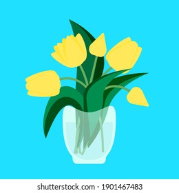 yellow tulips in a glass vase