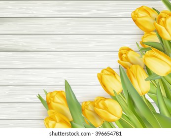 Yellow tulips over wooden table background. EPS 10 vector file included