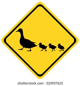 yellow warning sign ducks family