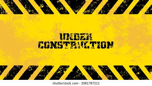 yellow warning sign. under construction background.