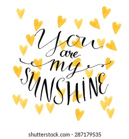 Yellow watercolor hearts background with modern calligraphy quote your are my sunshine. Vector design for cards with rough typography