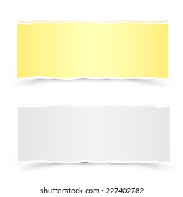 The yellow and white torn pieces of paper on the white background