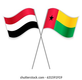 Yemeni and Bissau-Guinean crossed flags. Yemen combined with Guinea_Bissau isolated on white. Language learning, international business or travel concept.