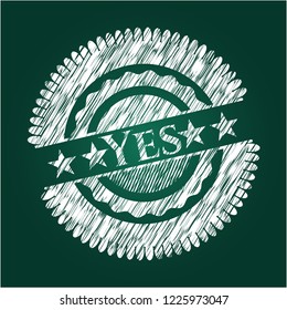 Yes chalk emblem written on a blackboard