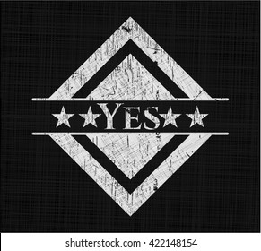 Yes chalk emblem written on a blackboard
