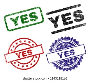 YES seal prints with damaged style. Black, green,red,blue vector rubber prints of YES text with retro style. Rubber seals with circle, rectangle, rosette shapes.