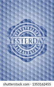 Yesterday blue badge with geometric pattern background.